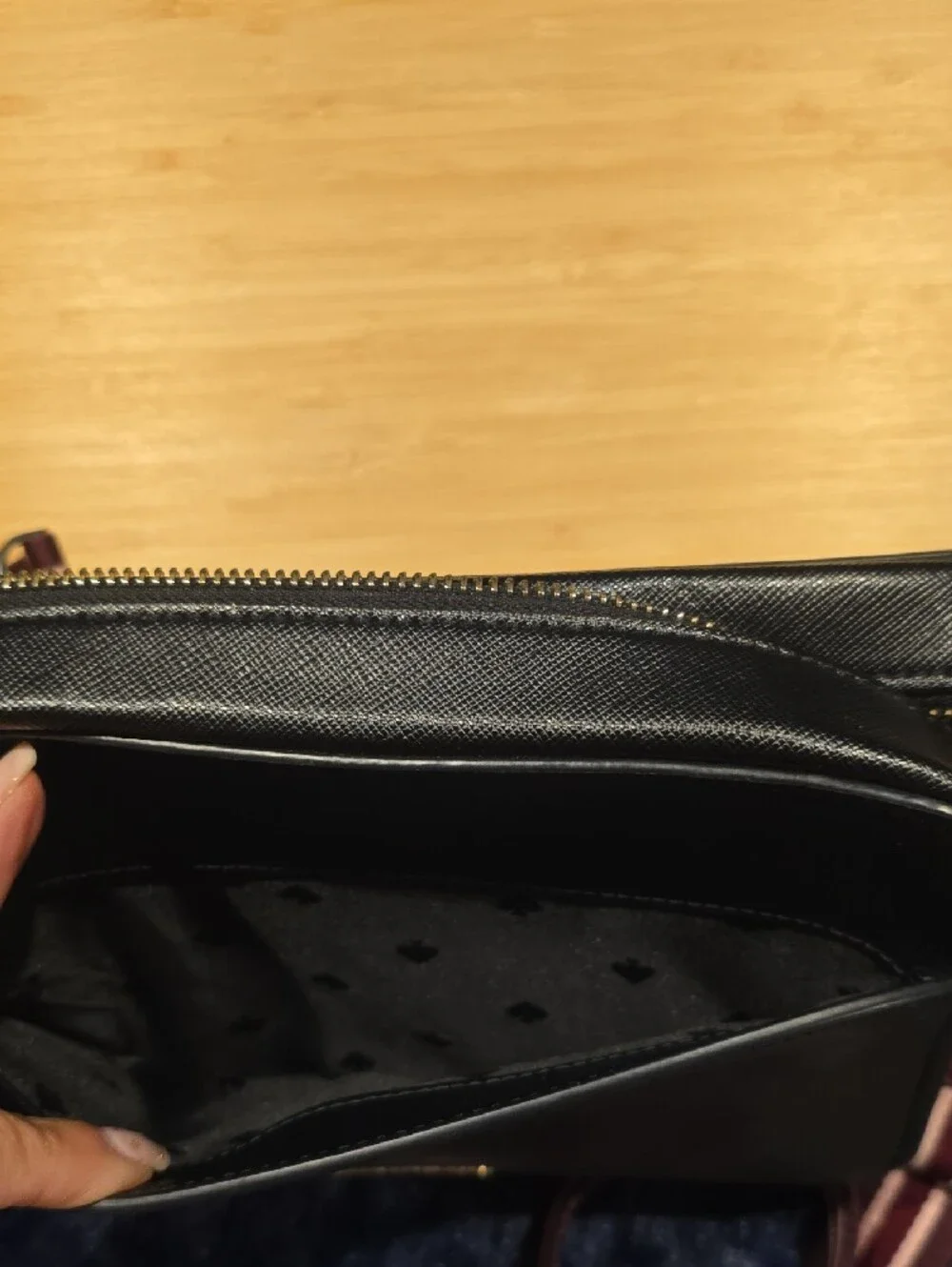 kate spade Lauryn black leather camera bag with burgundy striped strap